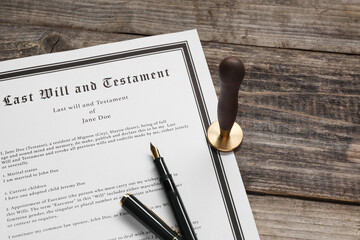 Last Will and Testament with wax stamp and fountain pen on wooden table, above view