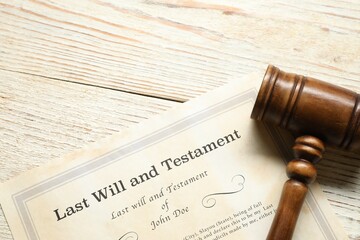 Last Will and Testament with gavel on white wooden table, top view. Space for text
