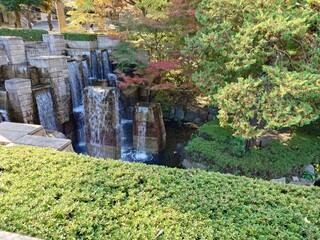 beautiful waterfall in autumn park