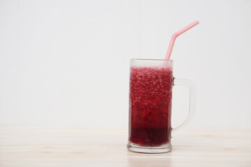 Glass of red fruit smoothie with drinking straw. Concept, healthy beverage for health. Well being...