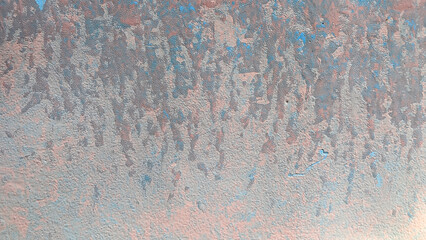 Abstract textured surface with a blend of blue and rusty hues