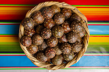 basket full of cactus pitaya fruit. Stenocereus queretaroensis