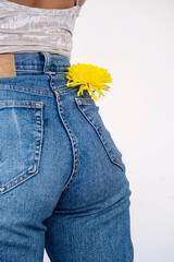 Jeans pocket with blooming flower. Floral chic.