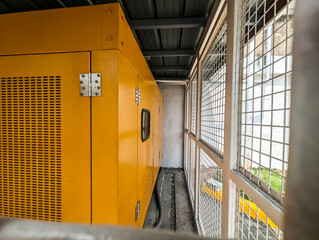 An enclosed commercial backup generator for a business establishment. Placed outdoor and inside a...