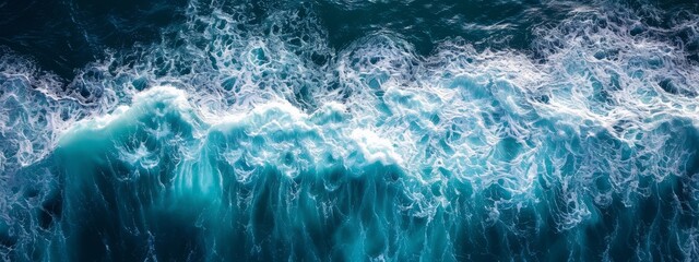 beautiful photo of blue water flowing in waves with white foam in a ocean. taken from up top above perspective. very wide banner wallpaper background 8:3 - obrazy, fototapety, plakaty