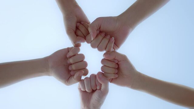 Low angle view of group hand people joining for cooperation success business, teamwork join hand together, Volunteer charity work