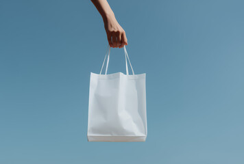 hand holding shopping bag.Minimal creative advertise concept.Copy space,text space,top view.Generative AI