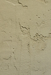 The texture of the wall, covered with gray foam polystyrene plates, which are smeared with a reinforcing mixture. Stage of wall insulation
