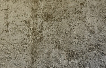 Texture of the old embossed concrete wall in gray color. Background image of a concrete product