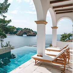 Deck chairs on terrace with pool with stunning sea view. Mediterranean white architecture. Summer vacation
