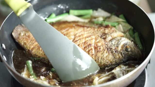 Close-up view of stir-fried gourami fish