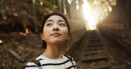 Nature, thinking and Japanese woman in forest for adventure on holiday, vacation and morning....
