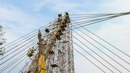 Construction of a cable-stayed bridge with a crane and scaffolding