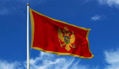 Montenegro Flag on the flag pole waving beautifully in the sky