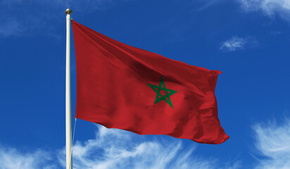 Morocco flag on the flag pole waving beautifully in the sky