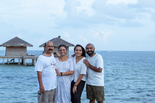 Picture of an Indian family enjoying vacation in Maldives