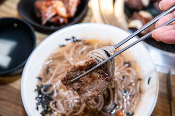 Buckwheat Noodles with Radish Water Kimchi with beef bbq