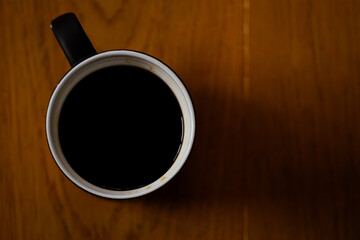 cup of coffee on wooden table
