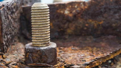 Rusty bolt and nut on the old rusty metal. Selective focus.