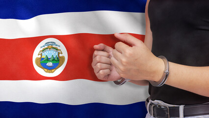 A man getting under arrest in Costa Rica. Concept of being handcuffed, detained, incarcerated and...