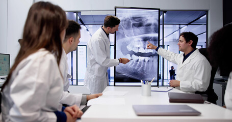 Dentist Doctor Looking At Teeth Xray - obrazy, fototapety, plakaty