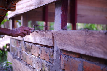 A worker who is cementing.