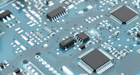 Circuit board with resistors microchips and electronic components background. Computer hardware...
