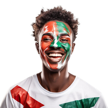 front view of a handsome man with his face painted with a Sudan flag colors smiling isolated on a white transparent background 