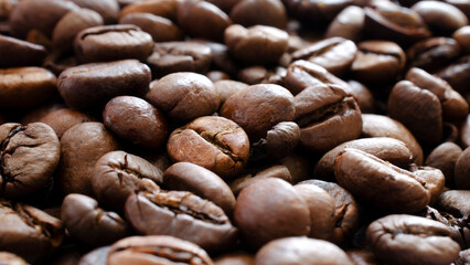Roasted coffee background, texture, top view. Top view of coffee beans, background, texture. Coffee beans as a background for packaging use.