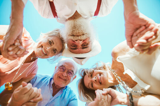 Group Of Seniors Making A Picnic At The Park And Having Fun