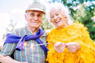 old modern couple dressing fashionable colored clothes