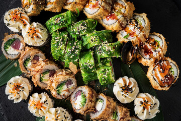 set of sushi on the black background