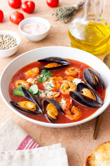 Bouillabaisse soup with fish, mussels and shrimps. French cuisine. Seafood.