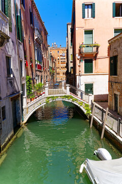 Scenic view of bridge with canal at Italian City of Venice on a sunny summer day. Photo taken August 7th, 2023, Venice, Italy.