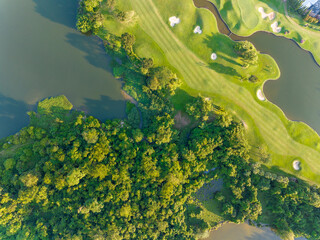 Aerial view of beautiful green golf field fairway and putting green, Top down image for sport background and travel nature background, Amazing  green nature view