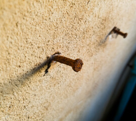 Rusty nails on the wall