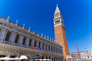 Old town of Italian City of Venice with famous Campanile of cathedral at Piazza San Marco square on a sunny summer day. Photo taken August 7th, 2023, Venice, Italy. - obrazy, fototapety, plakaty