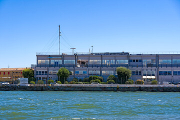 Naklejka premium Old town of Italian City of Venice with passenger terminal at port on a sunny summer day. Photo taken August 7th, 2023, Venice, Italy.