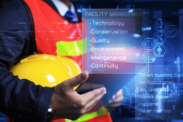 Facility management concept with engineer checking smart building application on tablet connected iot technology management to planning preventive maintenance schedule and improve the system