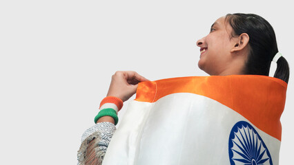 Ceremony of 76 Republic Day of India, backside view of a young Indian girl showing pride to be...