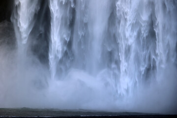 Water wall of the Skogafoss waterfall on the Skógá River in southern Iceland