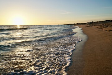 Sea waves with foam on the shoreline 15