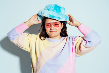 Plus size woman model posing in studio and having fun.