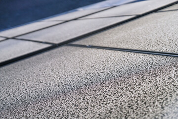 Frost pattern on photovoltaic modules on a cold sunny day in winter
