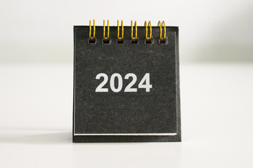Calendar template for the new year, 2024. Place it elegantly on your clean, white work desk for a...