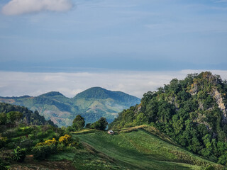 Fototapeta na wymiar The green landscape view of a mountain in Si Nan National Park, Nan, Thailand.