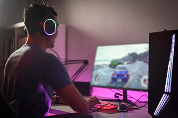 Cropped shot pro gamer in headset playing online video games and streaming during tournament