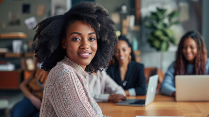 Group of African American employees or small business owner start-up looking camera working meeting sitting in workplace room, creative workers using technology laptop computer, teamwork entrepreneur