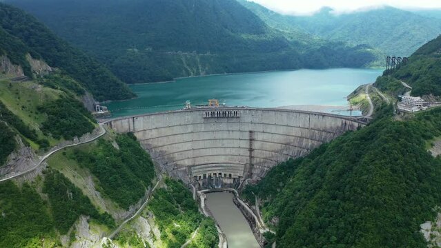 Inguri hydroelectric power plant in Georgia. Aerial view from drone of huge water dam. Hydropower energy station on Inguri River.