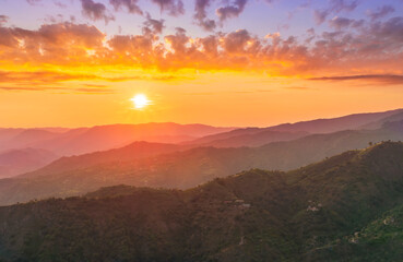 summer scenery mountain view from a highland hill to a beautiful sunset.